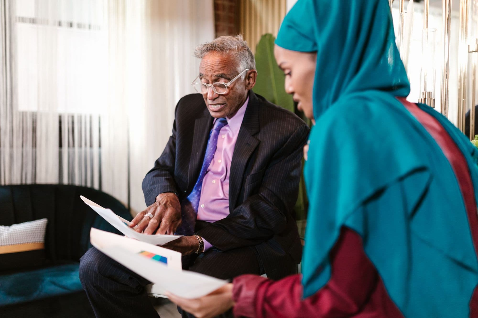 Two members talking through a document